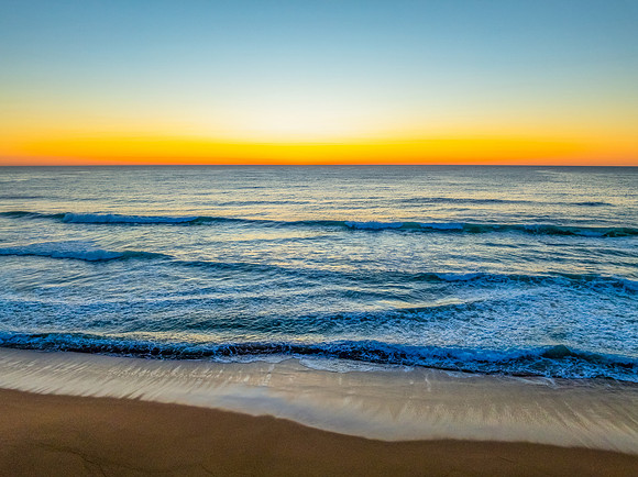 Sunrise at the seaside with a cloudless sky