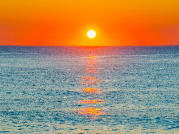 Orange Horizon: Sunrise by the Sea
