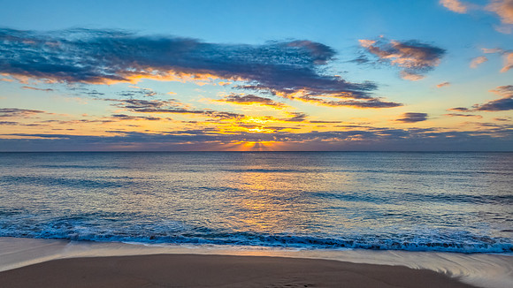 Sunrise Seascape Over Gentle Ocean Swells