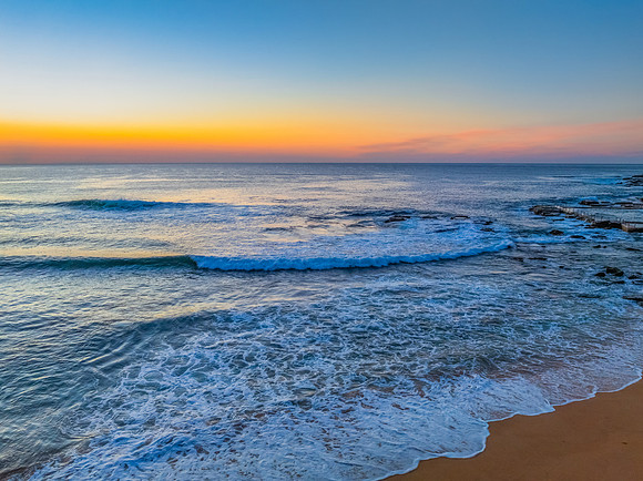 Blush Horizon: Sunrise by the Sea