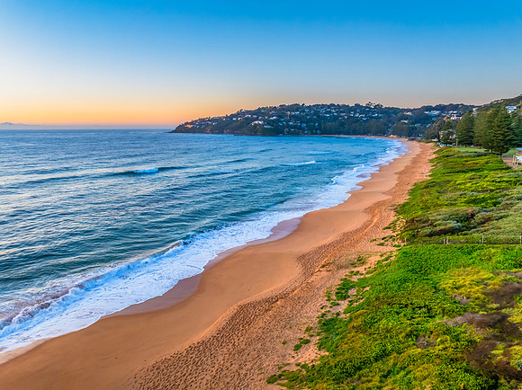 Sunrise at the Seaside with Clear Blue Skies