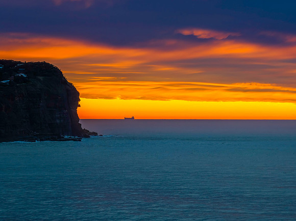 Cloud filled sunrise seascape