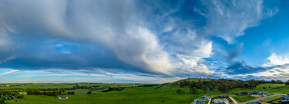 Sunset panorama views over rural farmland with beautiful cloud f