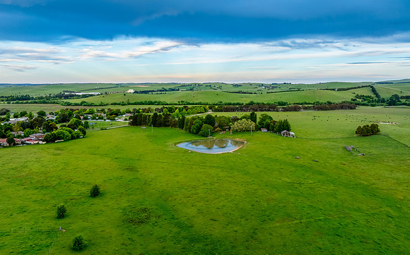 Sunset views over rural farmland with beautiful cloud formations