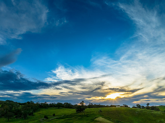 Sunset views over rural farmland with beautiful cloud formations