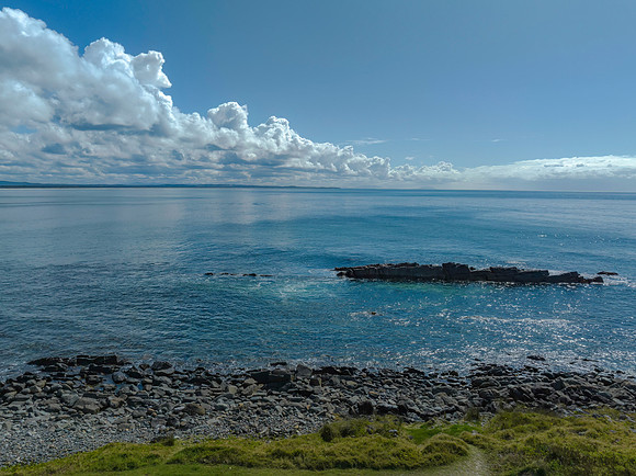 Cumulus clouds and the ocean on a beautiful Spring day