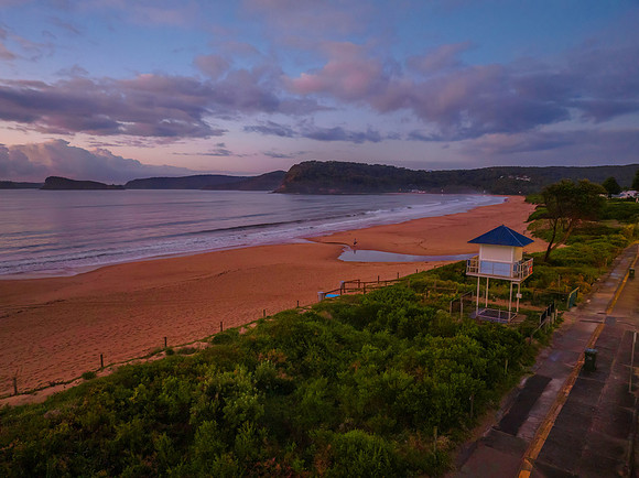 Aerial sunrise seascape with rain clouds