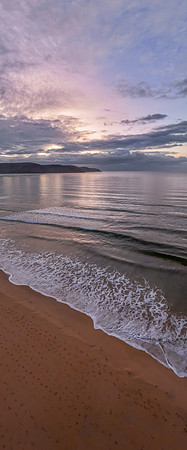Aerial sunrise seascape with rain clouds