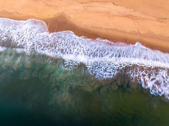 Aerial sunrise top down seascape