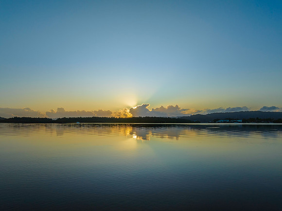 Soft and subtle sunrise glow over the bay