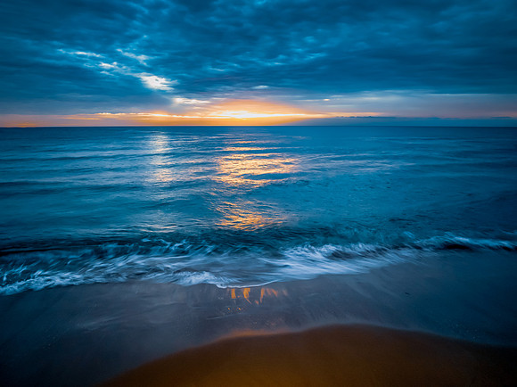 Sunrise at the Seaside with rain clouds