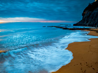 Sunrise at the Seaside with rain clouds