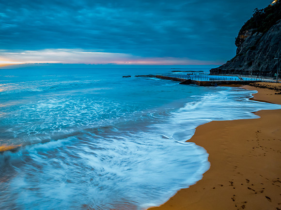 Sunrise at the Seaside with rain clouds