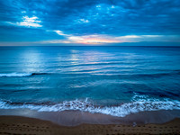 Sunrise at the Seaside with rain clouds