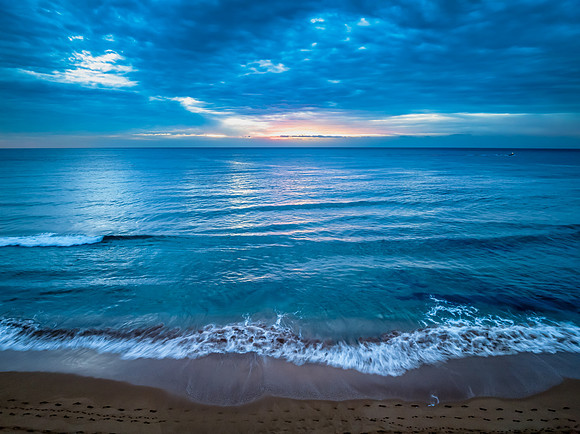 Sunrise at the Seaside with rain clouds