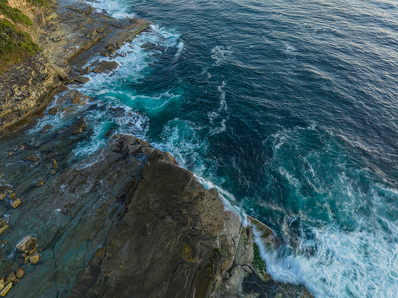 Top down sea and rock platform in the early morning light