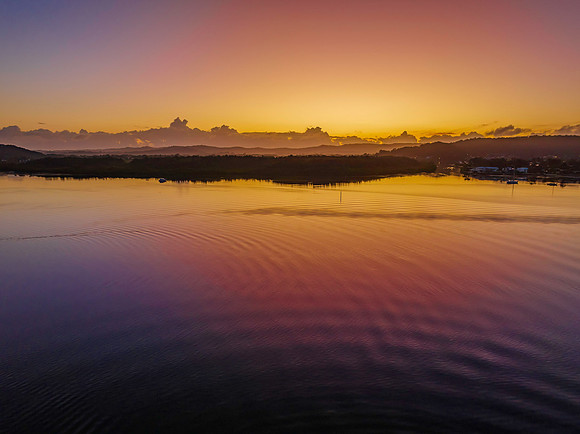 Soft and subtle sunrise waterscape over the bay
