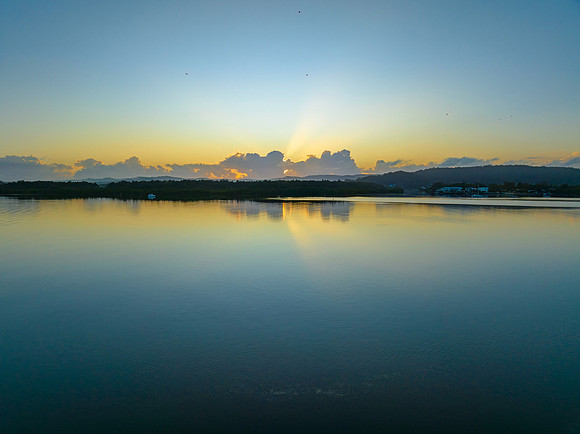 Soft and subtle sunrise waterscape over the bay