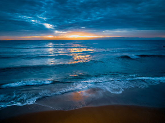 Sunrise at the Seaside with rain clouds