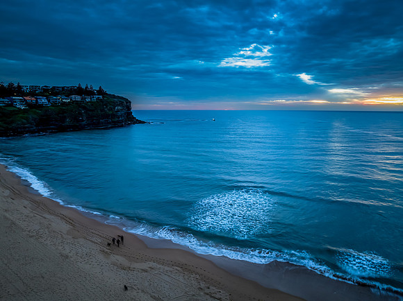 Sunrise at the Seaside with rain clouds