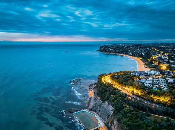 Sunrise at the Seaside with rain clouds