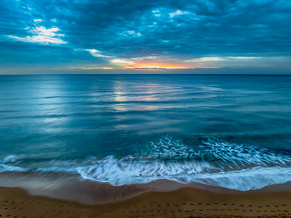 Sunrise at the Seaside with rain clouds