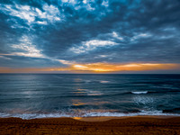 Sunrise at the Seaside with rain clouds