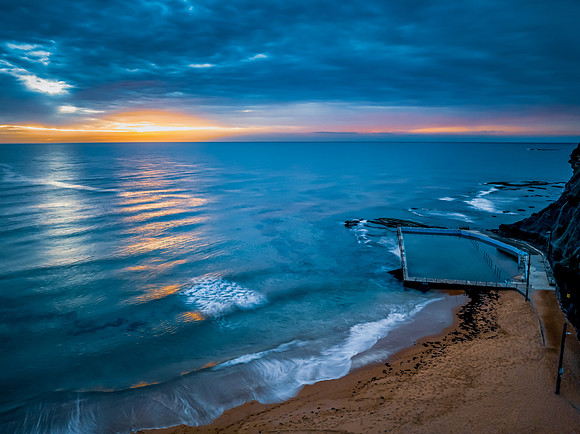 Sunrise at the Seaside with rain clouds