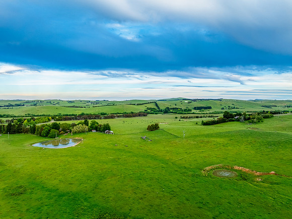 Sunset views over rural farmland with beautiful cloud formations