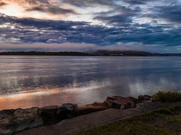 Respite from the rain - Bay waterscape with reflections