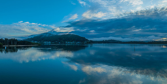 Respite from the rain - Bay waterscape with reflections