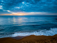 Sunrise at the Seaside with rain clouds
