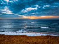 Sunrise at the Seaside with rain clouds