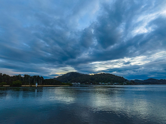 Respite from the rain - Bay waterscape with reflections