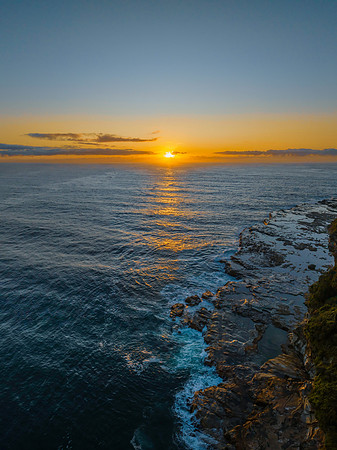 Sunrise over the ocean with rocks