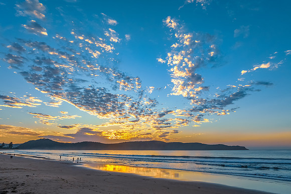 Sunrise seascape with pretty clouds in the sky