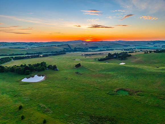 Sunrise over the countryside on the outskirts of country town wi