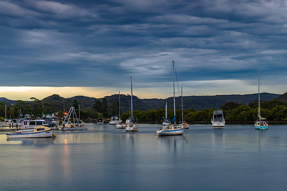 Sunrise with rain clouds over the bay
