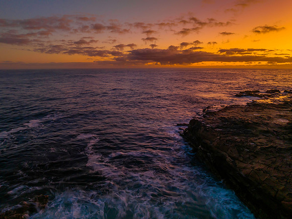 Dawn by the ocean with rocks