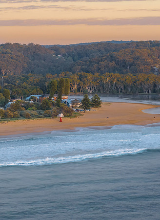 Sunrise at the seaside with lagoon, beach and trees