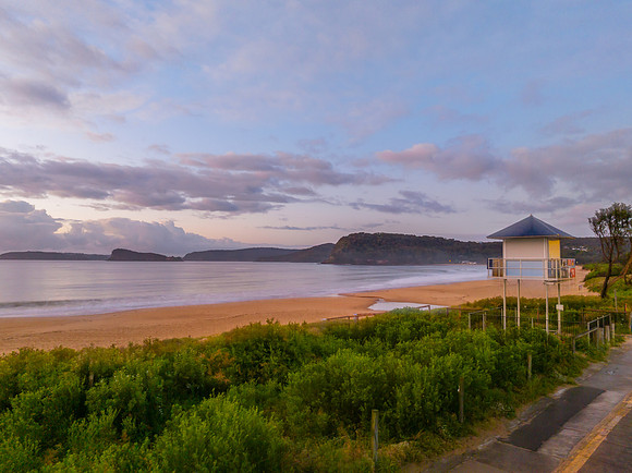Aerial sunrise seascape with rain clouds