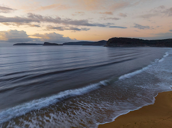 Aerial sunrise seascape with rain clouds