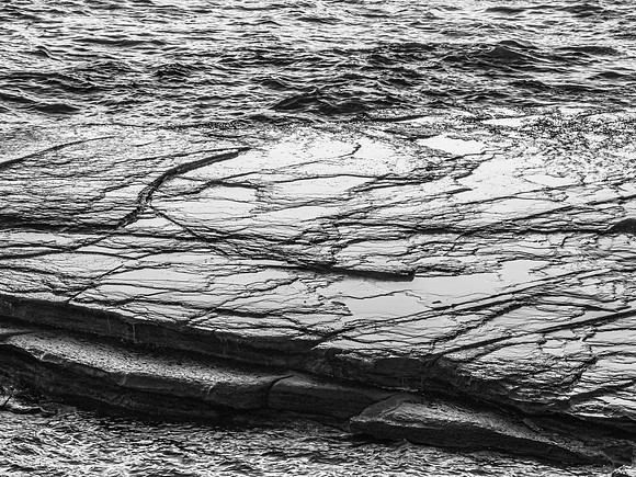 Top down sea and rock platform in black and white