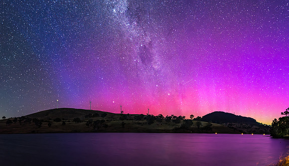 A Pink Aurora Australis and the Milky Way Shimmers Over the Dam