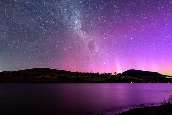 A Pink Aurora Australis and the Milky Way Shimmers Over the Dam