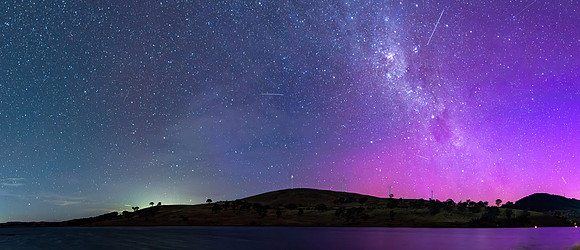A Pink Aurora Australis and the Milky Way Shimmers Over the Dam