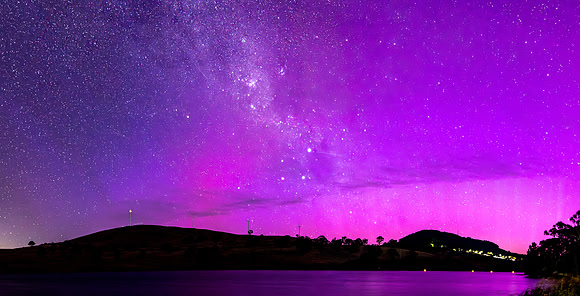 A Pink Aurora Australis and the Milky Way Shimmers Over the Dam