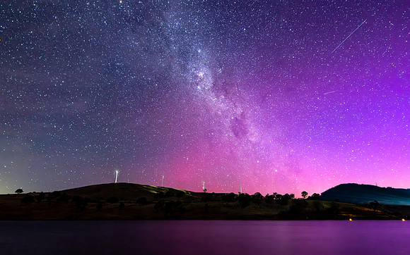 A Pink Aurora Australis and the Milky Way Shimmers Over the Dam