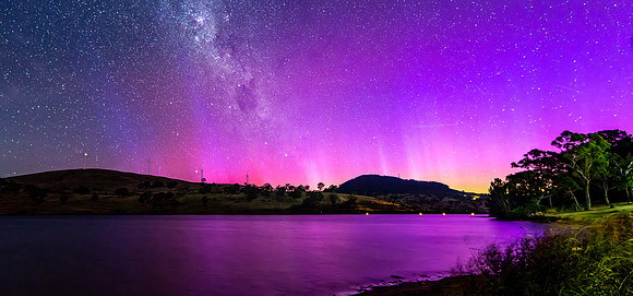 A Pink Aurora Australis and the Milky Way Shimmers Over the Dam