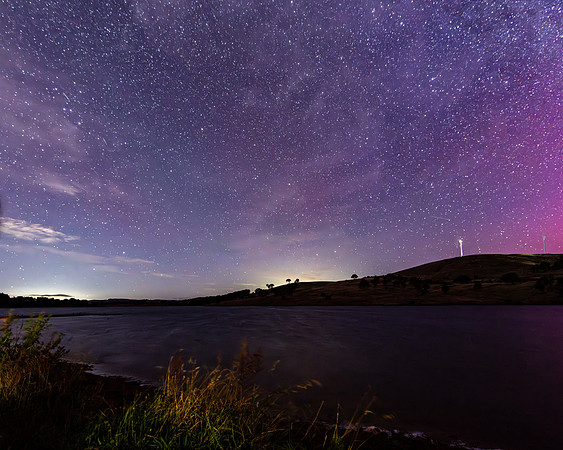 A Pink Aurora Australis and the Milky Way Shimmers Over the Dam